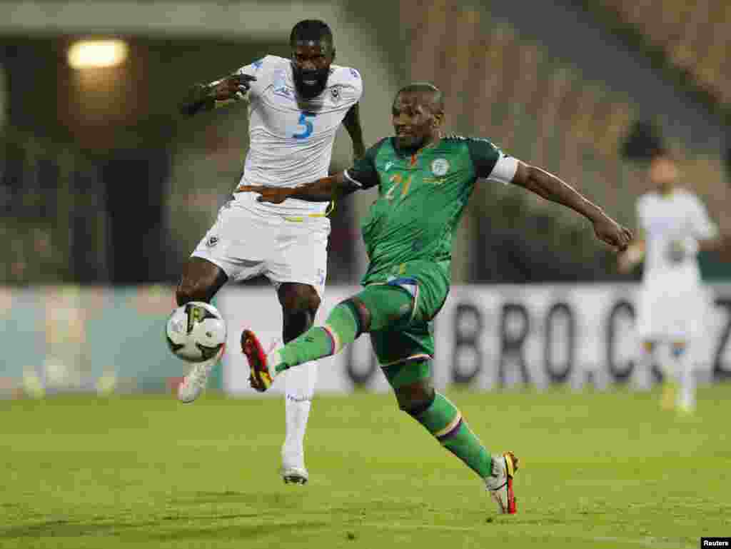 Comoros&#39; El Fardou Ben Nabouhane in action with Gabon&#39;s Bruno Ecuele Manga.