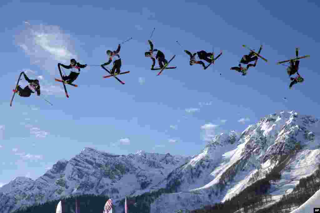 In this image made with a multiple exposure, Finland's Antti Ollila competes in the men's ski slopestyle qualifying at the Rosa Khutor Extreme Park during the 2014 Winter Olympics in Krasnaya Polyana, Russia.