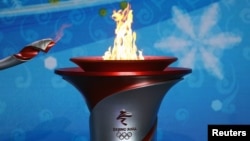 奥林匹克火炬抵达北京。（2021年10月20日）