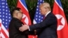 FILE - U.S. President Donald Trump shakes hands with North Korea leader Kim Jong Un at the Capella resort on Sentosa Island, June 12, 2018, in Singapore.