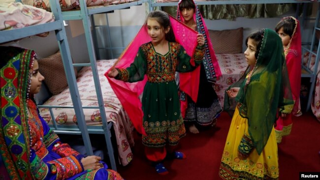 Afghan girls chat to each others at an Afghan Child Education and Care Organization center (AFCECO) in Kabul, Afghanistan March 3, 2019.