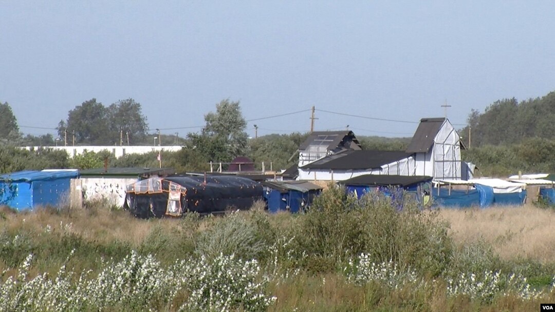 The 'Jungle' migrant camp, seen here, is due to be completely demolished by year's end, in Calais, France. (L. Bryant/VOA)
