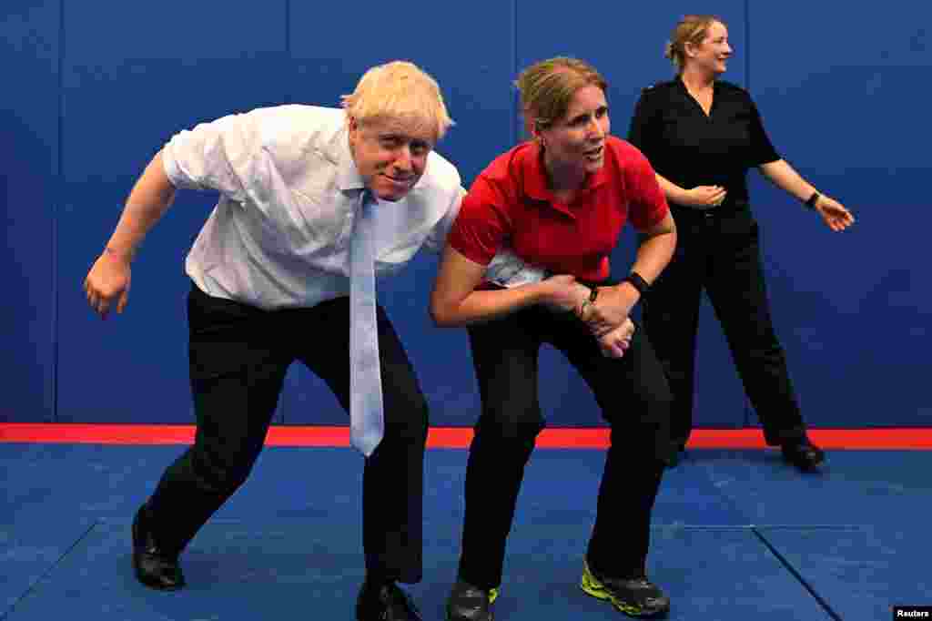 Boris Johnson, a leadership candidate for Britain&#39;s Conservative Party, reacts as he visits the Thames Valley Police Training Centre in Reading, Britain.