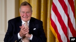 Former President George H.W. Bush is publicly criticizing for the first time key members of his son's administration. A biography of the nation's 41st president to be published in Nov. 2015, contains his sharply critical assessments of Cheney and Rumsfeld. 