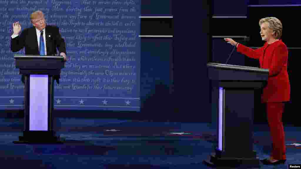 Republican presidential nominee Donald Trump and Democratic presidential nominee Hillary Clinton speak during their first presidential debate at Hofstra University in Hempstead, N.Y., Sept. 26, 2016. 