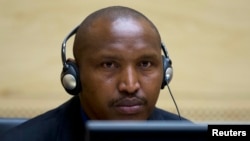 Congolese warlord Bosco Ntaganda looks on during his first appearance before judges at the International Criminal Court in the Hague, March 26, 2013. 