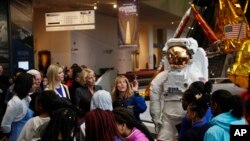 Ivanka Trump, third from left to right, and Education Secretary Betsy DeVos, listen to NASA Astronaut Kay Hire, during their visit to the Smithsonian's National Air and Space Museum in Washington, March 28, 2017, to celebrate Women's History Month.