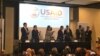 El presidente de Colombia, Iván Duque, estrecha su mano con Mark Green, director de USAID, en la Cumbre Concordia Americas.