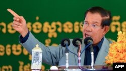 FILE PHOTO- Cambodia's Prime Minister Hun Sen speaks during a groundbreaking ceremony for the construction of a bridge across the Bassac river in Phnom Penh on October 26, 2020. (Photo by TANG CHHIN Sothy/AFP) 