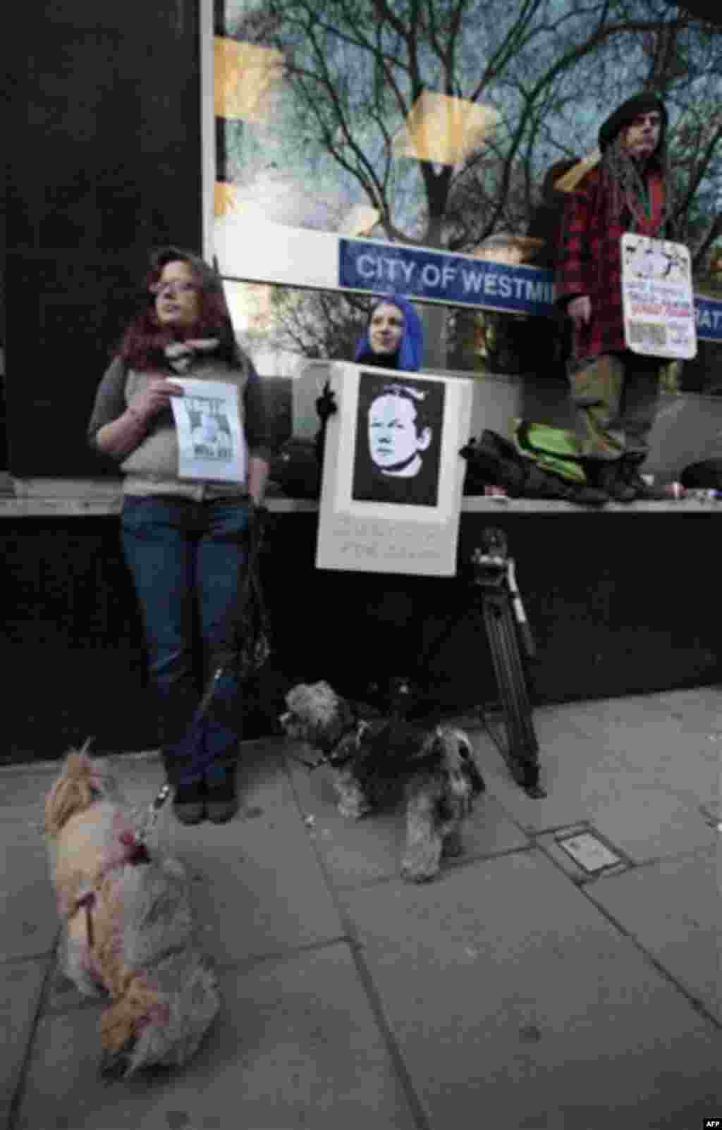 Supporters of Wikileaks founder Julian Assange, gather outside the City of Westminster Magistrates Court in London where Julian Assange's case was heard, Tuesday, Dec. 7, 2010. Julian Assange was jailed Tuesday after the WikiLeaks founder told a London co