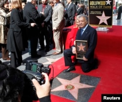 International orchestral and operatic conductor Zubin Mehta and his wife Nancy pose during ceremonies honoring Mehta with a star on the Hollywood Walk of Fame in Hollywood, California, March 1, 2011.