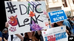Demonstrators make their way around downtown, Monday, July 25, 2016, in Philadelphia, during the first day of the Democratic National Convention after some of the 19,000 emails, presumably stolen from the DNC by hackers, were posted to the website Wikilea