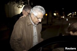 Khosrow Afghahi makes his way to a waiting car at Federal Detention Center Houston in Houston, Texas, Jan. 17, 2016.