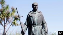 FILE - A statue of Junipero Serra at the Carmel Mission, Sept. 23, 2015, in Carmel-By-The-Sea, California. 