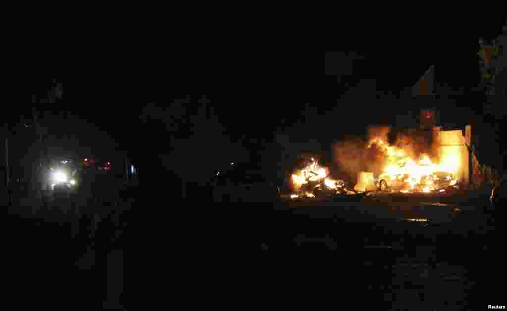 Fire burns at the scene of an explosion outside the Jazeera Hotel in Mogadishu, Jan. 1, 2014. 