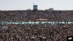 A large portrait of Yemen's President Ali Abdullah Saleh is seen as supporters gather at a soccer stadium for Saleh to speak in Sanaa March 10, 2011