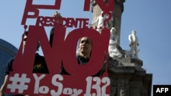 People protest against Mexican President Enrique Pena Nieto, on the first anniversary of his goverment in Mexico City, Dec. 1, 2013.
