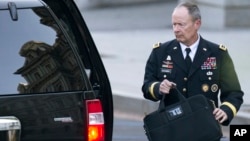 National Security Agency Director General Keith Alexander leaves the White House in Washington, Oct. 2, 2013.