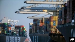 FILE - Container ships are seen at the Port of Savannah, Georgia, Sept. 29, 2021. A World Trade Organization arbitrator has decided that China can impose tariffs on imports from the United States totaling up to $645 million a year.