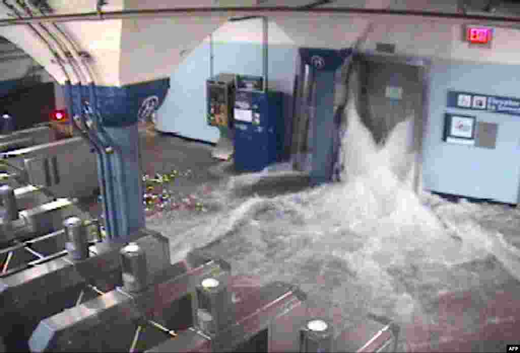 This CCTV photo released by the official Twitter feed of The Port Authority of New York & New Jersey shows flood waters from Hurricane Sandy rushing in to the Hoboken PATH station through an elevator shaft on Oct. 29, 2012 in Hoboken, New Jersey. (AFP PHO