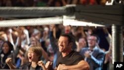 Hugh Jackman and Dakota Goyo star as a father and son who reconnect with the help of a prize-fighting robot in "Real Steel."