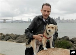 This 2011 photo shows Timothy Ray Brown, the only man ever known to have been apparently cured from AIDS, with his dog, Jack, on Treasure Island in San Francisco. (Courtesy Photo)