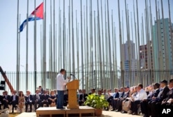 FILE - Cuban-American Poet Richard Blanco reads a poem during the reopening ceremony of the U.S. embassy in Havana, Cuba, Aug. 14, 2015.