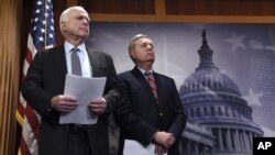  FILE - Sen. John McCain, R-Ariz., (left) and Sen. Lindsey Graham, R-S.C., wait to speak during a news conference on Capitol Hill in Washington.
