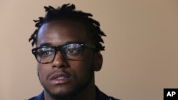 Donte Robinson listens to a reporter's question during an interview with the Associated Press Wednesday April 18, 2018 in Philadelphia. His arrest, along with Rashon Nelson at a local Starbucks quickly became a viral video and galvanized people around the country who saw the incident as modern-day racism. 