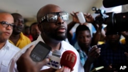 FILE - Haitian-American musician Wyclef Jean talks to the press in the Petion-Ville suburb of Port-au-Prince, Haiti, Nov. 20, 2016.