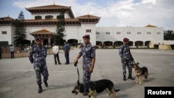 FILE - Nepalese police with sniffer dogs secure the premises of the parliament before President Ram Baran Yadav formally promulgates the new constitution in Kathmandu, Sept. 2015. 