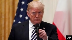 President Donald Trump holds a news conference with Polish President Andrzej Duda in the East Room of the White House, Sept. 18, 2018. 