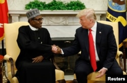 U.S. President Donald Trump meets with Nigeria's President Muhammadu Buhari in the Oval Office of the White House in Washington, April 30, 2018.