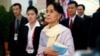 FILE - Myanmar State Counselor Aung San Suu Kyi walks between meetings at the ASEAN Summit in Vientiane, Laos Sept. 6, 2016. 