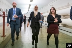 Rep. Ilhan Omar, D-Minn., walks to the chamber, March 7, 2019, on Capitol Hill in Washington, as the House was preparing to vote on a resolution to speak out against, as Speaker of the House Nancy Pelosi said, "anti-Semitism, anti-Islamophobia, anti-white