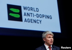 FILE - Pavel Kolobkov, Minister of Sport of Russia addresses the Symposium of the World Anti Doping Agency (WADA) in Ecublens, Switzerland, March 13, 2017.
