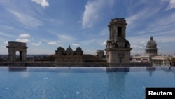 A historic building is seen from the rooftop infinity pool at the Gran Hotel Manzana, owned by the Cuban government and managed by Swiss-based Kempinski Hotels SA, in Havana, Cuba, May 12, 2017. 