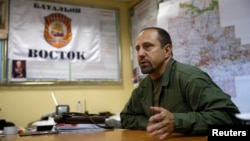 FILE - Rebel commander Alexander Khodakovsky of the so-called Vostok battalion - or "Eastern" battalion - speaks during an interview in Donetsk, July 8, 2014.