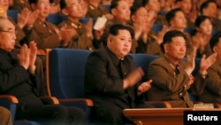 North Korean leader Kim Jong Un, center, applauds during a concert in this undated photo released by North Korea's Korean Central News Agency (KCNA) in Pyongyang, Feb. 23, 2016. U.N. diplomats told reporters about a new sanctions agreement Wednesday, a day before the U.N. Security Council is set to hold closed consultations on the issue.