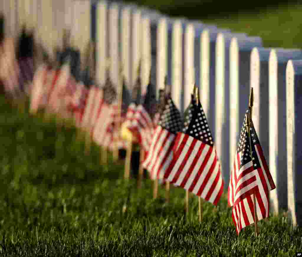 Flags mark graves at Leavenworth National Cemetery on the eve of Memorial Day, May 28, 2017, in Leavenworth, Kansas.