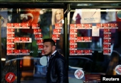 "Yes" stickers with pictures of Turkish President Recep Tayyip Erdogan are placed at a bus stop, in Istanbul, Turkey, April 14, 2017.