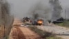 Hezbollah claimed responsibility for an attack Wednesday on an Israeli military convoy. Burning vehicles are seen near the village of Ghajar on Israel's border with Lebanon, Jan. 28, 2015. 