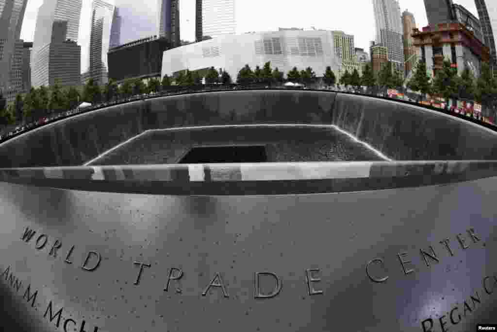 (FILE)The south pool of the 9/11 Memorial is seen as tourists visit ground zero in New York June 5, 2012. REUTERS/Eduardo Munoz