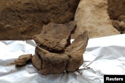 A base of a Neolithic jar is seen being prepared for sampling for residue analysis in this handout photo received Nov. 13, 2017.