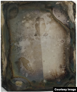 This 19th-century daguerreotype image shows the faintest outline of a woman, until the image is recovered through a new process, developed at Western University and Canadian Light Source Inc. (University of Western Ontario)