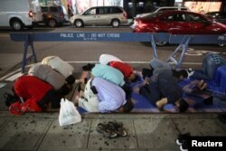American Muslim men perform tarawih prayers to mark the start of Ramadan outside the Islamic Society of Bay Ridge in Brooklyn, N.Y., May 26, 2017.