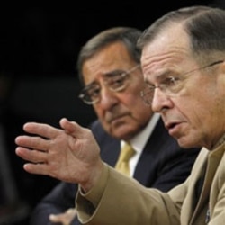 Defense Secretary Leon Panetta looks as Joint Chiefs Chairman Admiral Mike Mullen, front, speaks Tuesday near Washington.