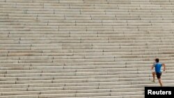 A runner ascends the steps leading up to the west side of the Lincoln Memorial in Washington, D.C., Oct. 18, 2012. The steps are a popular spot for fitness enthusiasts. 