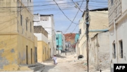 FILE - A handout photo taken on February 12, 2016 and released by AMISOM shows an elderly man walking through a street alley in the Somali port city of Merca, Lower Shabelle Region, Somalia. 