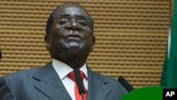 Zimbabwe president Robert Mugabe delivers a speech during the opening ceremony of the 26 ordinary of the African Union Summit in Ethiopian capital Addis Ababa, Saturday, Jan. 30, 2016. (AP Photo/Mulugeta Ayene)